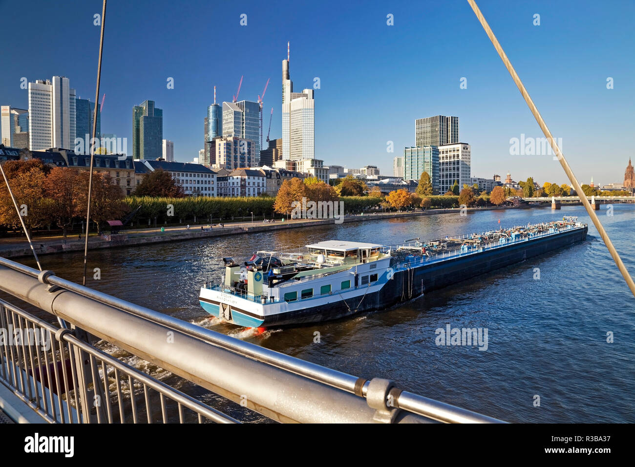 City view from Holbeinsteg with transport ship on the Main and the banking district in the background, Frankfurt am Main, Hesse Stock Photo