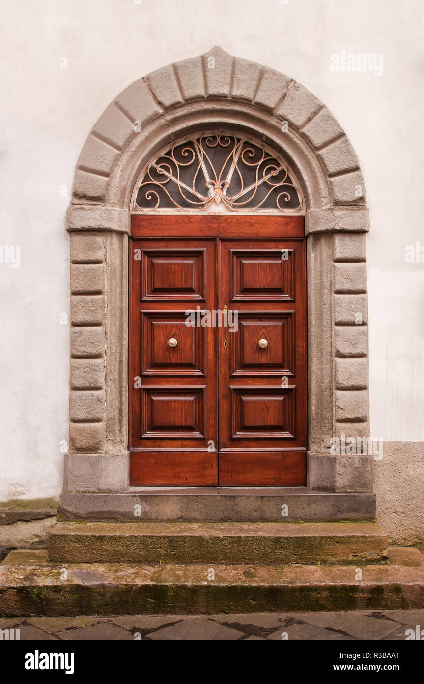 Picture with vintage brown wooden door and stone wall Stock Photo - Alamy