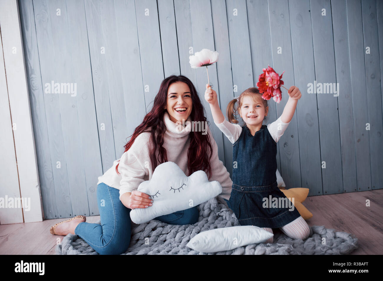 Happy loving family. Mother and her daughter child girl playing together Stock Photo