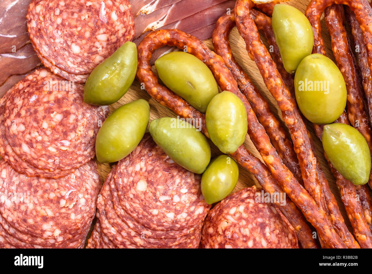 Assortment of meats kabanos, salami prosciutto slices and olive Stock