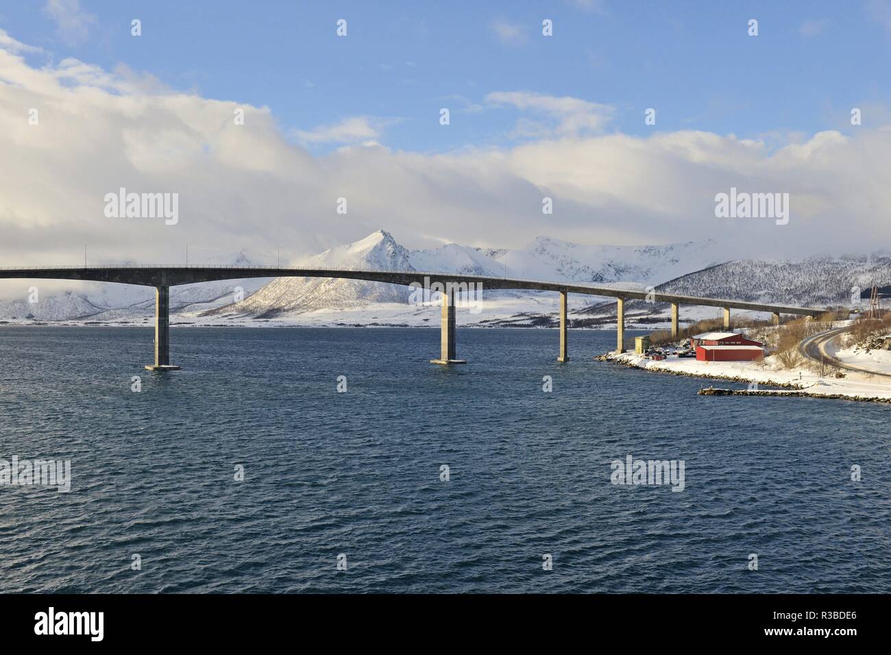 Bridge above the Risøysound in cloudy Vesterålen landscape with white ...
