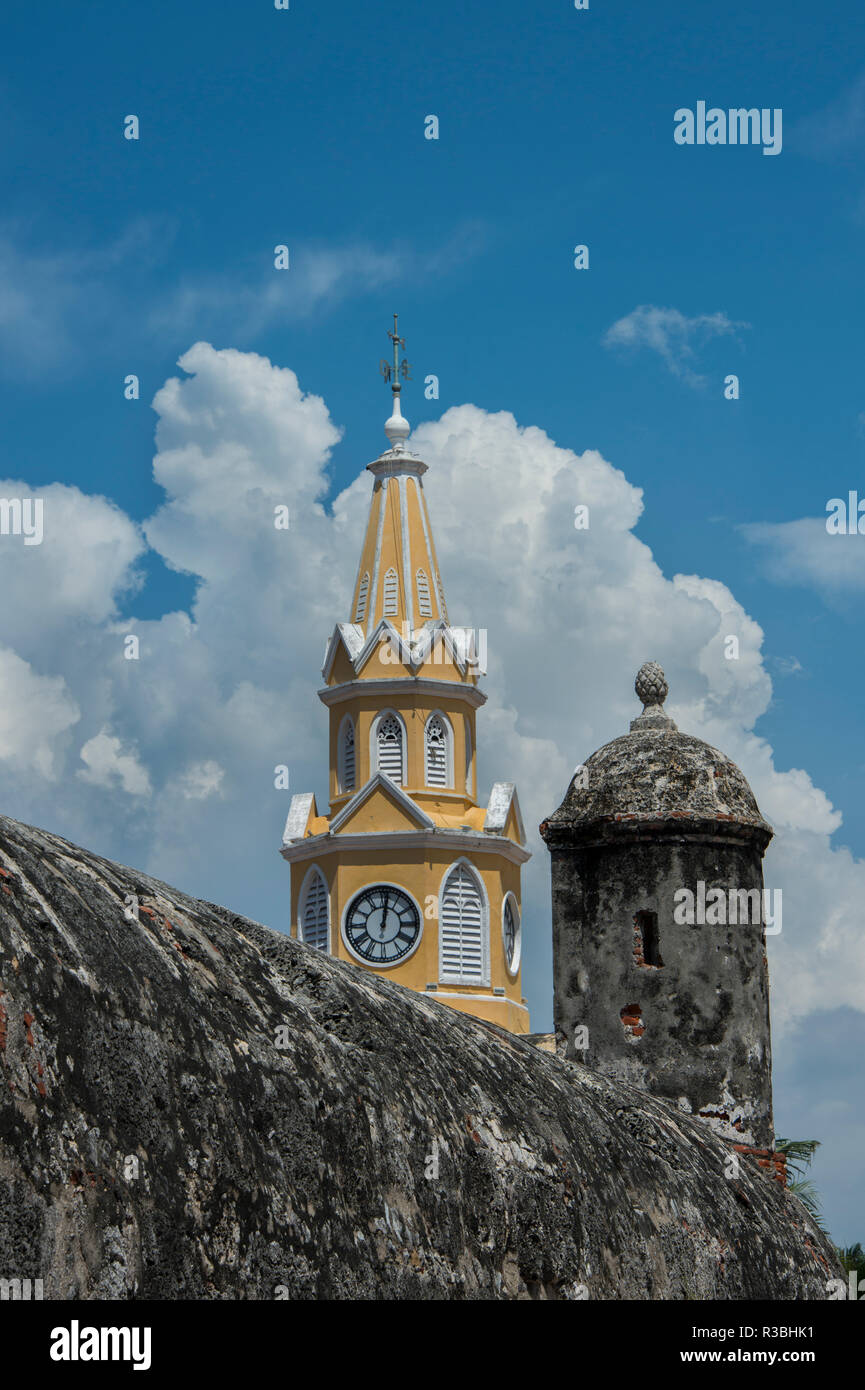 South America, Colombia, Cartagena. 'Old City' the historic city center, UNESCO. Clock Tower, aka Torre del Reloj with old city wall detail. Stock Photo