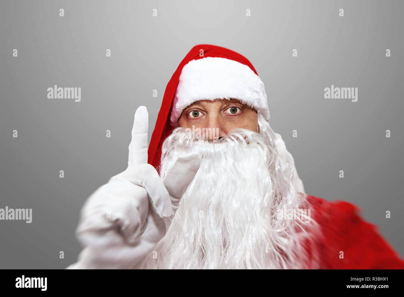 Santa Claus with raised forefinger Stock Photo