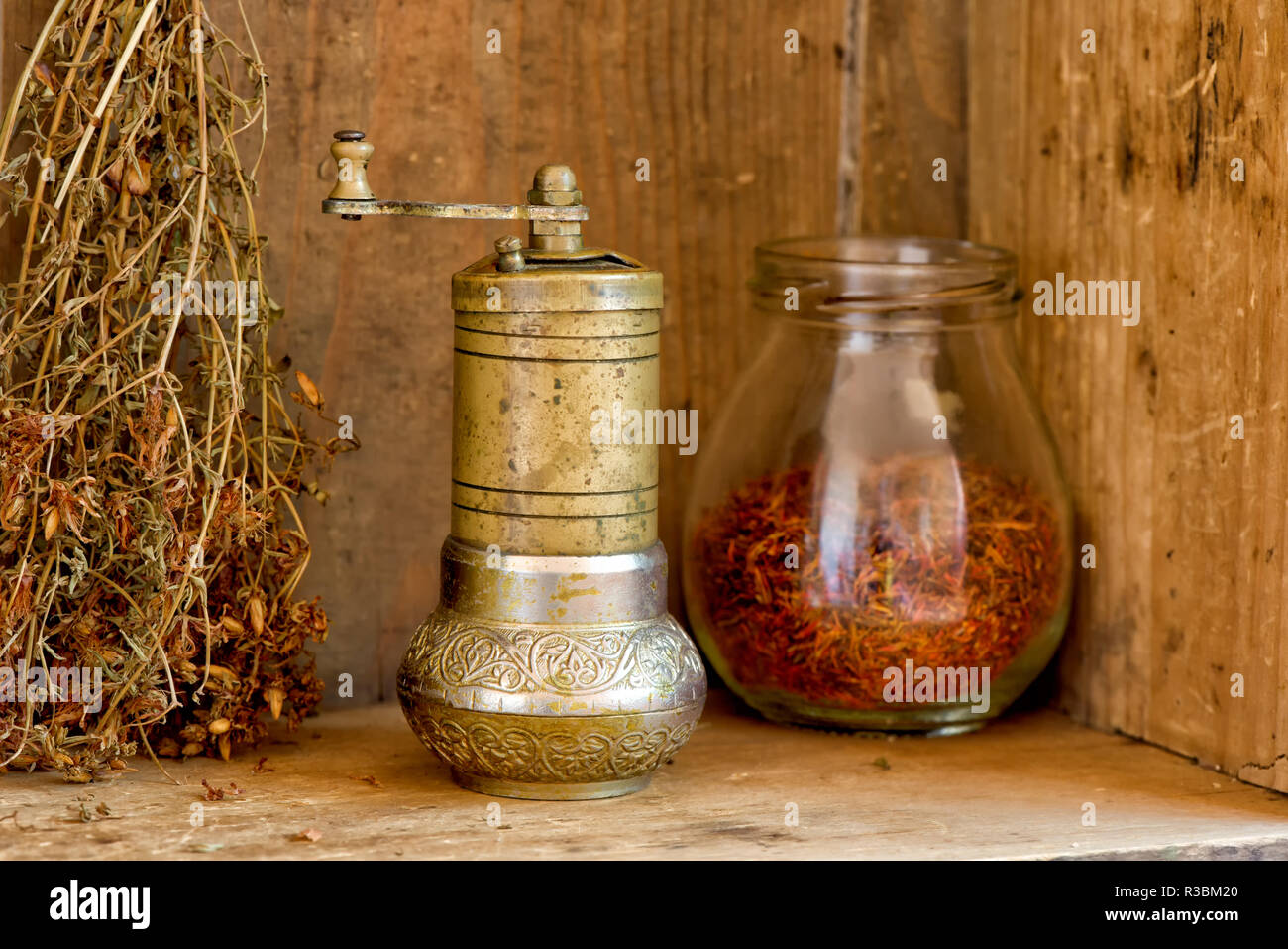 Vintage manual spice grinder on wooden background Stock Photo - Alamy