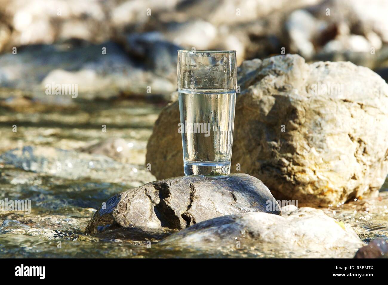 water glass on a torrent Stock Photo - Alamy