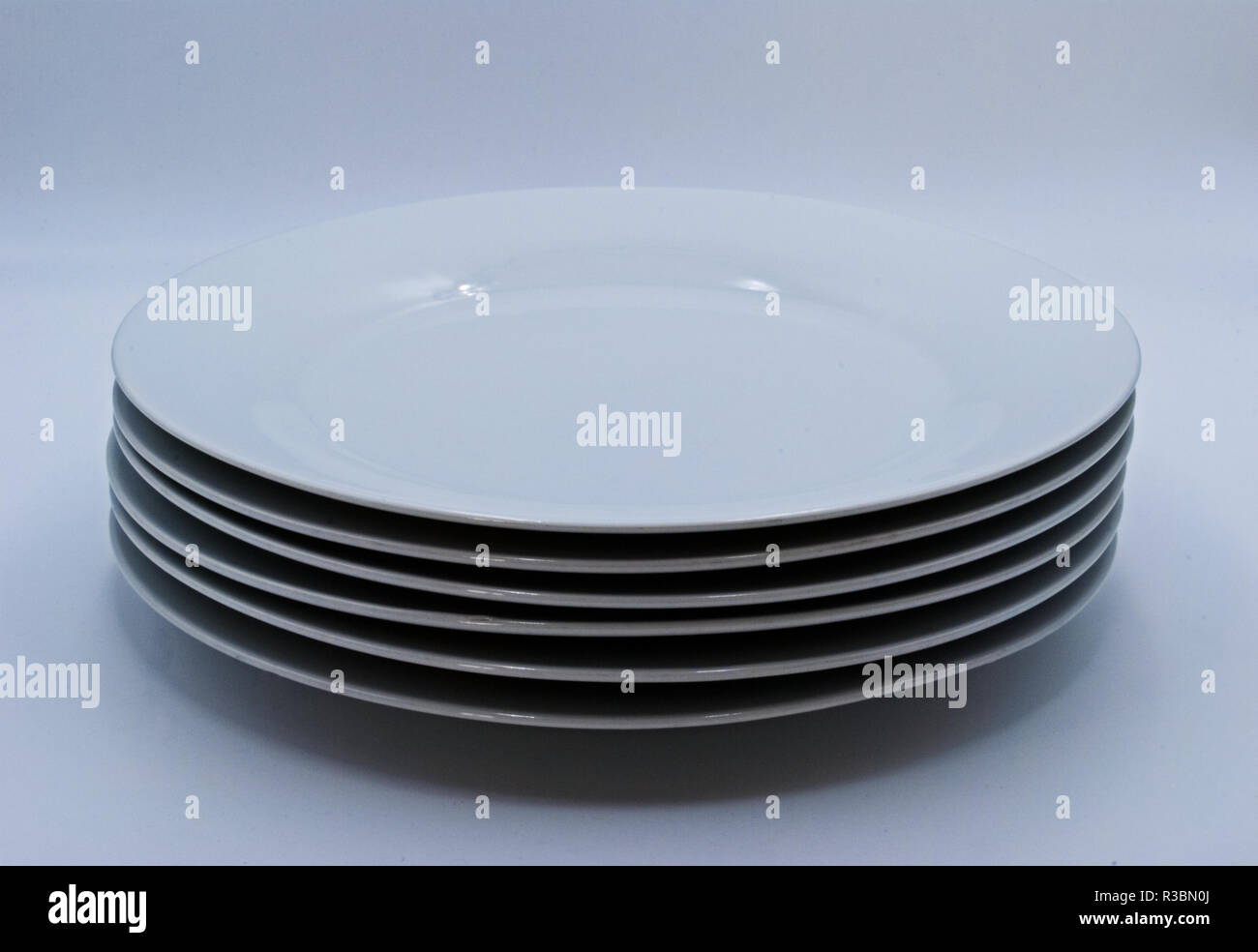 stack of plates on a white background Stock Photo
