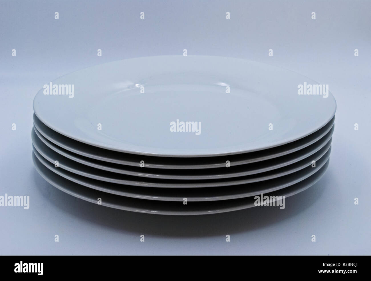 stack of plates on a white background Stock Photo - Alamy