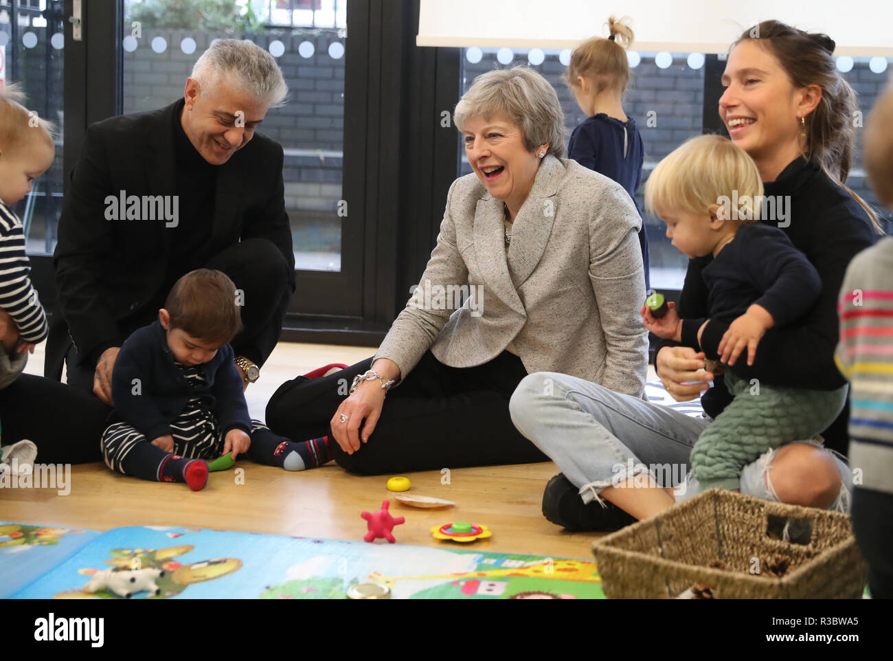 Prime Minister Theresa May And Health Social Care Secretary Matt Hancock Right Joins A Parent And Baby Group During A Visit To The Kentish Town Health Centre In North London Stock