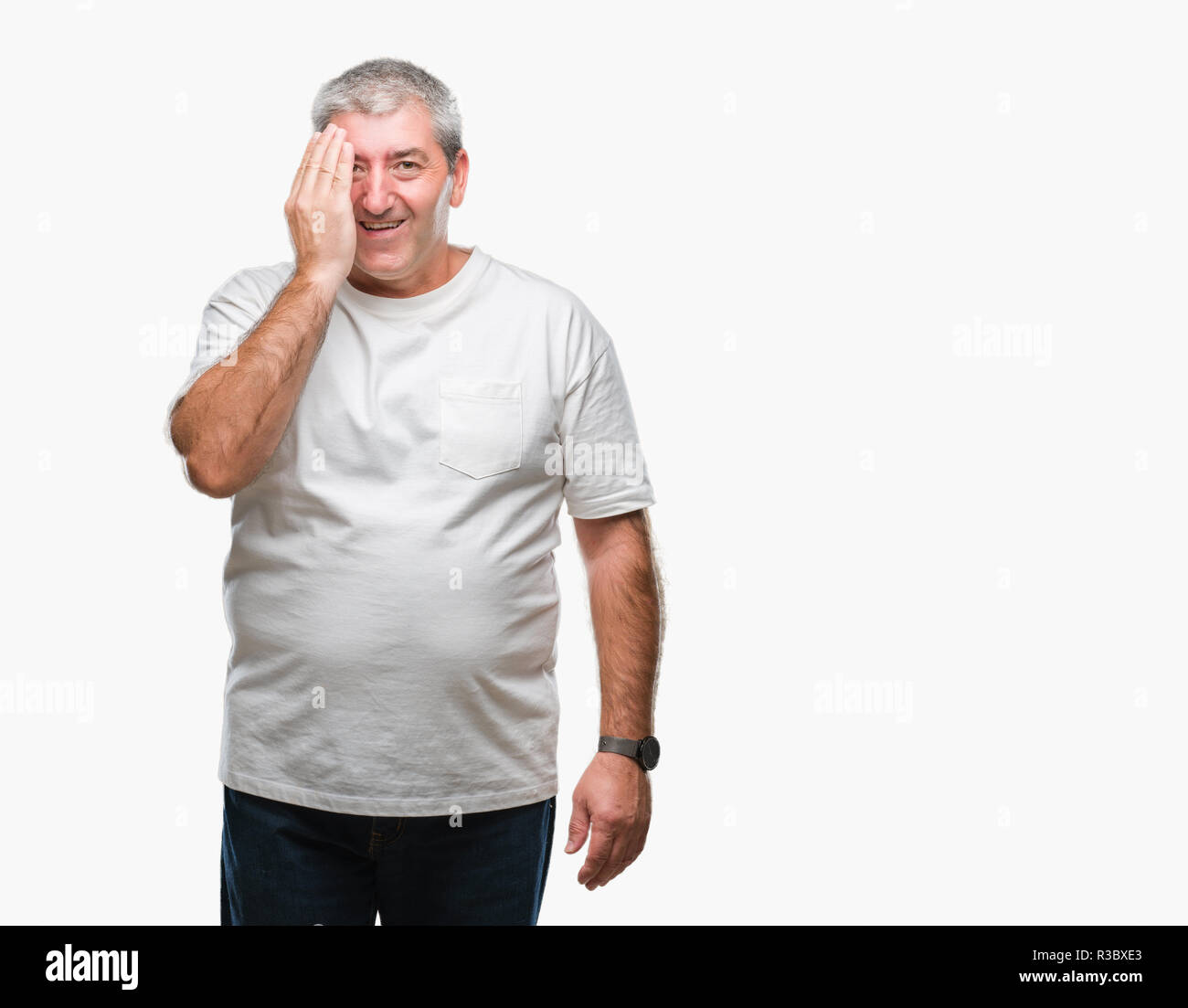 Handsome senior man over isolated background covering one eye with hand ...