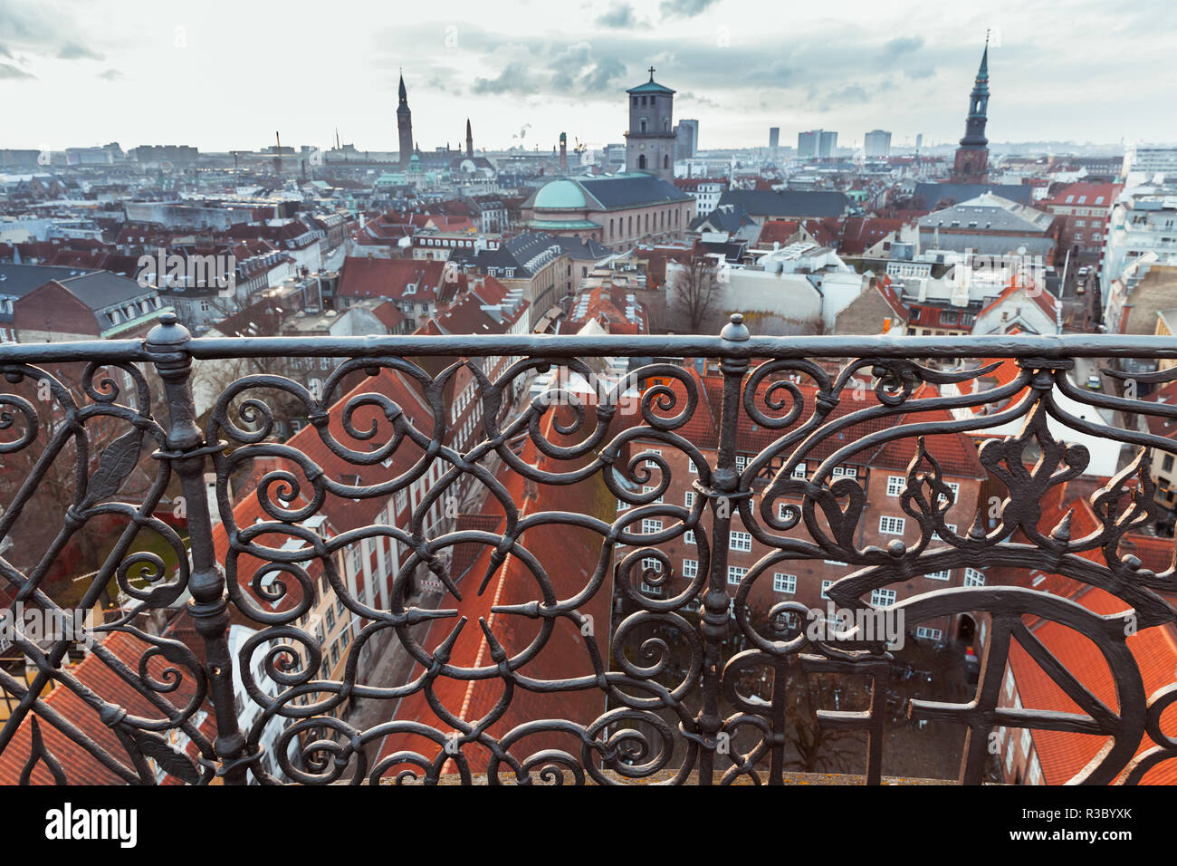 Skyline of Copenhagen, Denmark with decorative fence, photo taken from The Round Tower, popular old city landmark and viewpoint Stock Photo