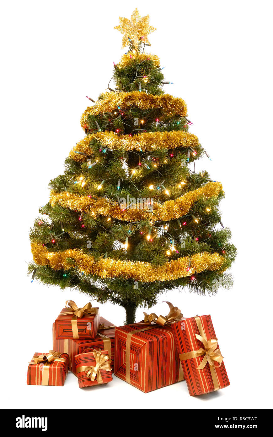 Beautiful green and gold Christmas tree with gifts on a white