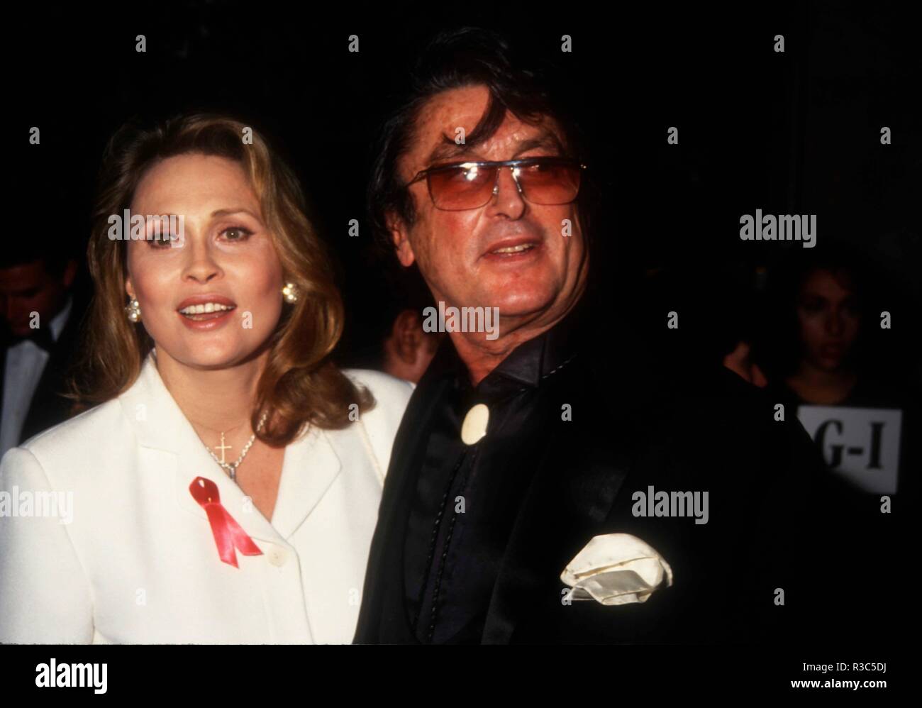 BEVERLY HILLS, CA - JANUARY 29: Actress Faye Dunaway and director Robert Evans attend The Daily Variety Salutes Army Archerd on January 29, 1993 at the Beverly Hilton Hotel in Beverly Hills, California. Photo by Barry King/Alamy Stock Photo Stock Photo