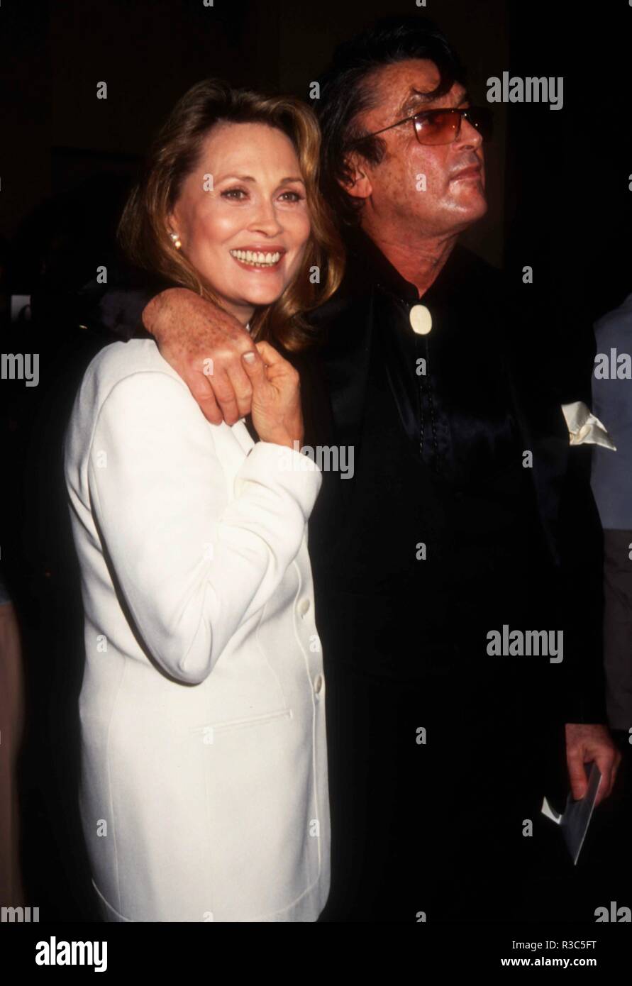 BEVERLY HILLS, CA - JANUARY 29: Actress Faye Dunaway and director Robert Evans attend The Daily Variety Salutes Army Archerd on January 29, 1993 at the Beverly Hilton Hotel in Beverly Hills, California. Photo by Barry King/Alamy Stock Photo Stock Photo