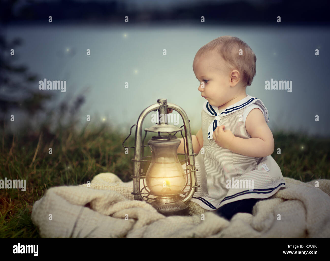 https://c8.alamy.com/comp/R3C8J6/baby-with-lantern-R3C8J6.jpg
