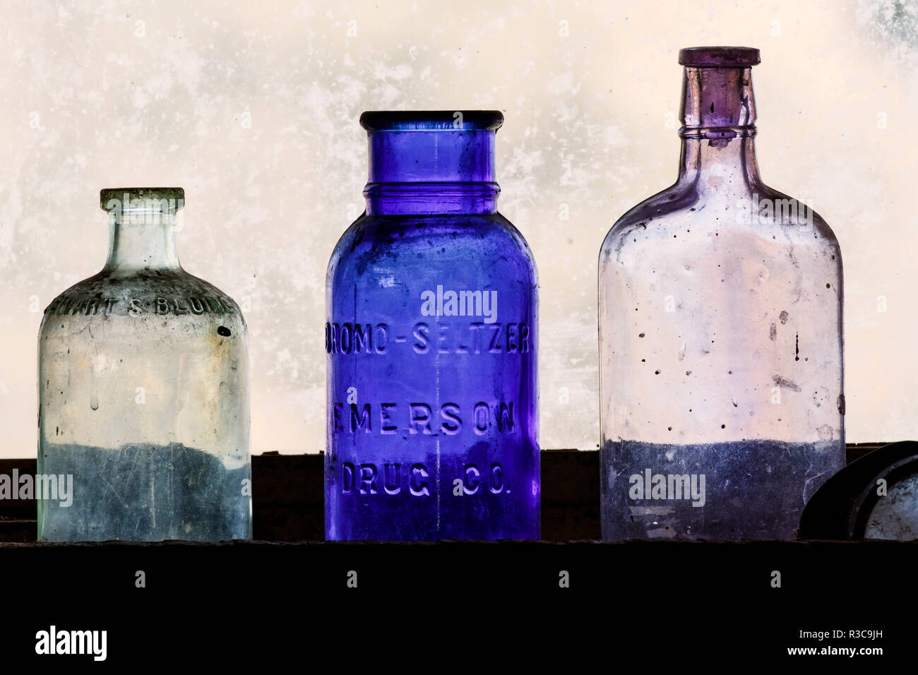 Antique bottles in window, Gold King Mine and Ghost Town, Jerome, Arizona Stock Photo