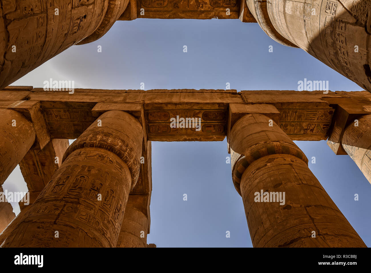 Columns and blue sky in the great hypostyle hall at the temple of Amon-Re in Karnak, Egypt, October 22, 2018 Stock Photo