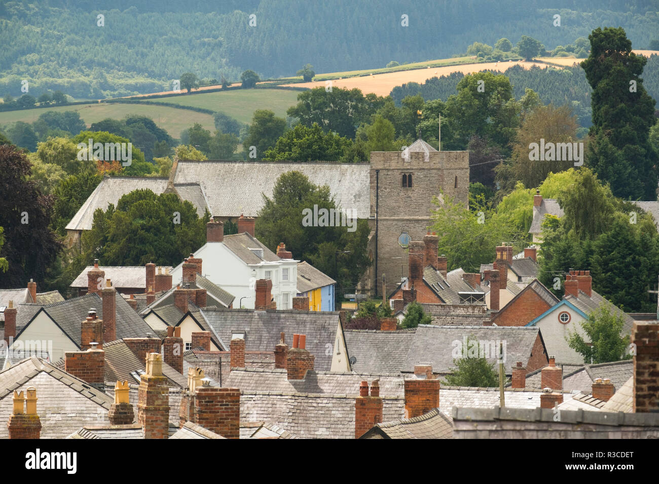 St John the Baptist parish church over the rooftops at Bishop's Castle, Shropshire, England, UK Stock Photo