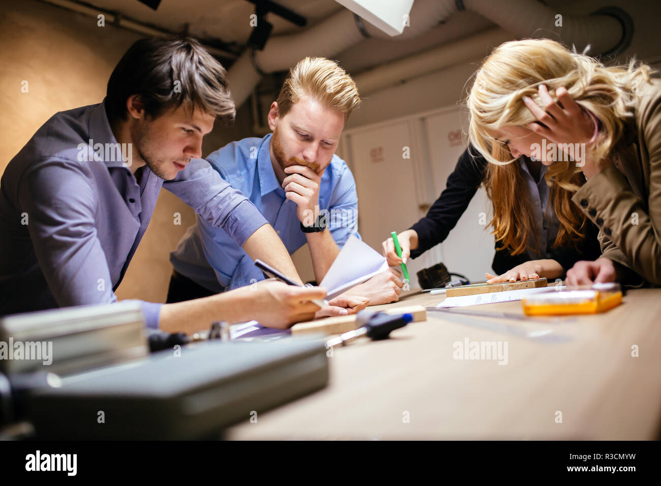 Business people collaborating in office and working on project together ...