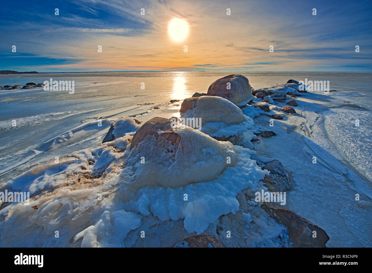 Canada, Manitoba, Winnipeg. Sunset on Lake Winnipeg spring ice Stock