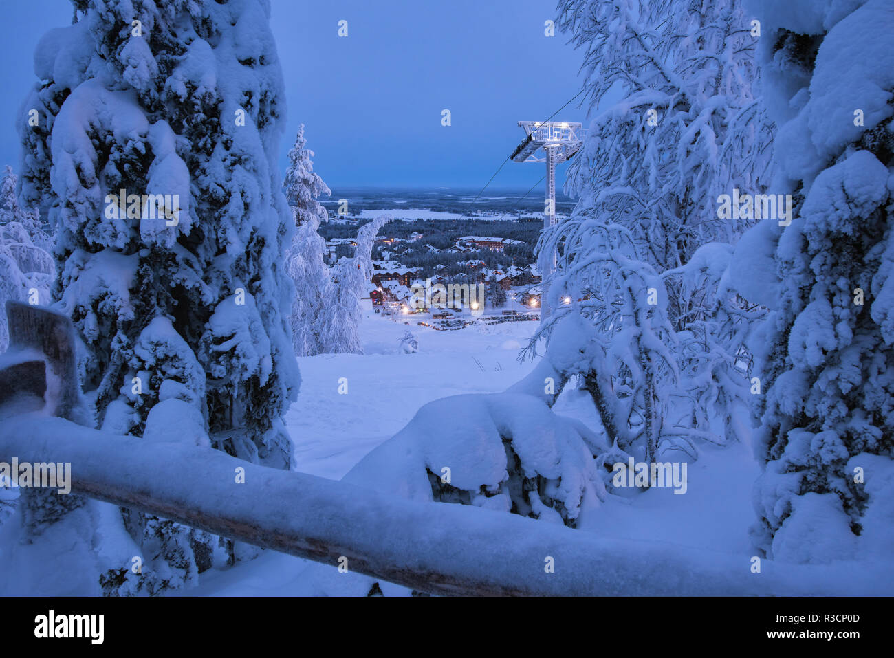 Winter wonderland evening landscape view on Levi ski resort in Laplandia,  Finland, with ski lift, village and trees covered by snow. Seasonal winter  g Stock Photo - Alamy