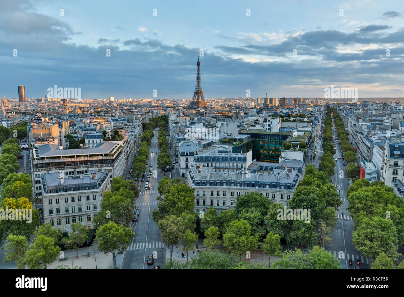 View from top of Arc de Triomphe in evening light with city lights and streets below, Paris, France. Stock Photo