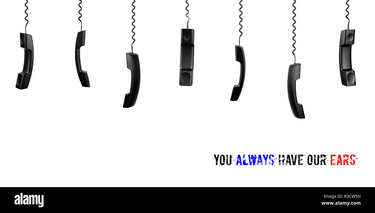 Black handsets hanging on twisted cords on a white background. Isolated. Concept call center, customer service, rescue service/ Stock Photo