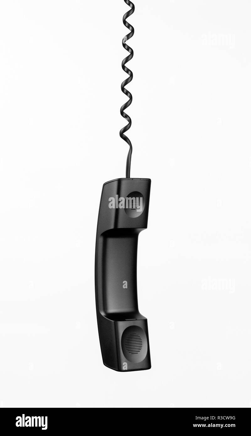 Handset with a twisted cord on a white background isolated. Stock Photo
