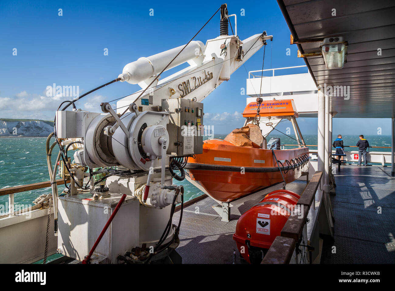 Orange Lifeboat on board Channel Ferry at sea with hydraulic winch on