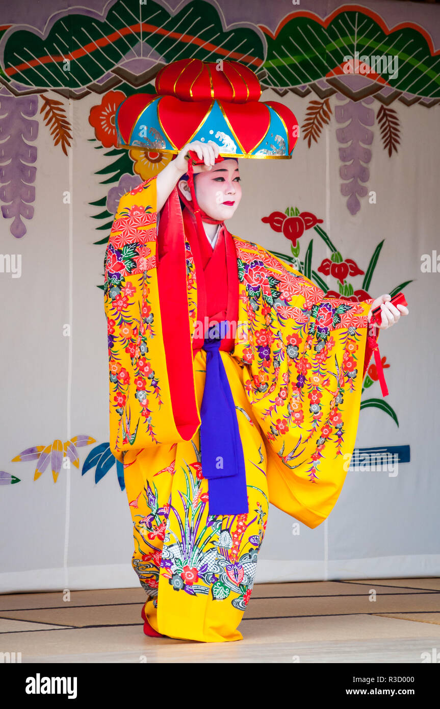 Okinawa, Japan - March 10, 2013 : Unidentified female dancer performing Okinawa traditional dance at Shuri Castle Stock Photo