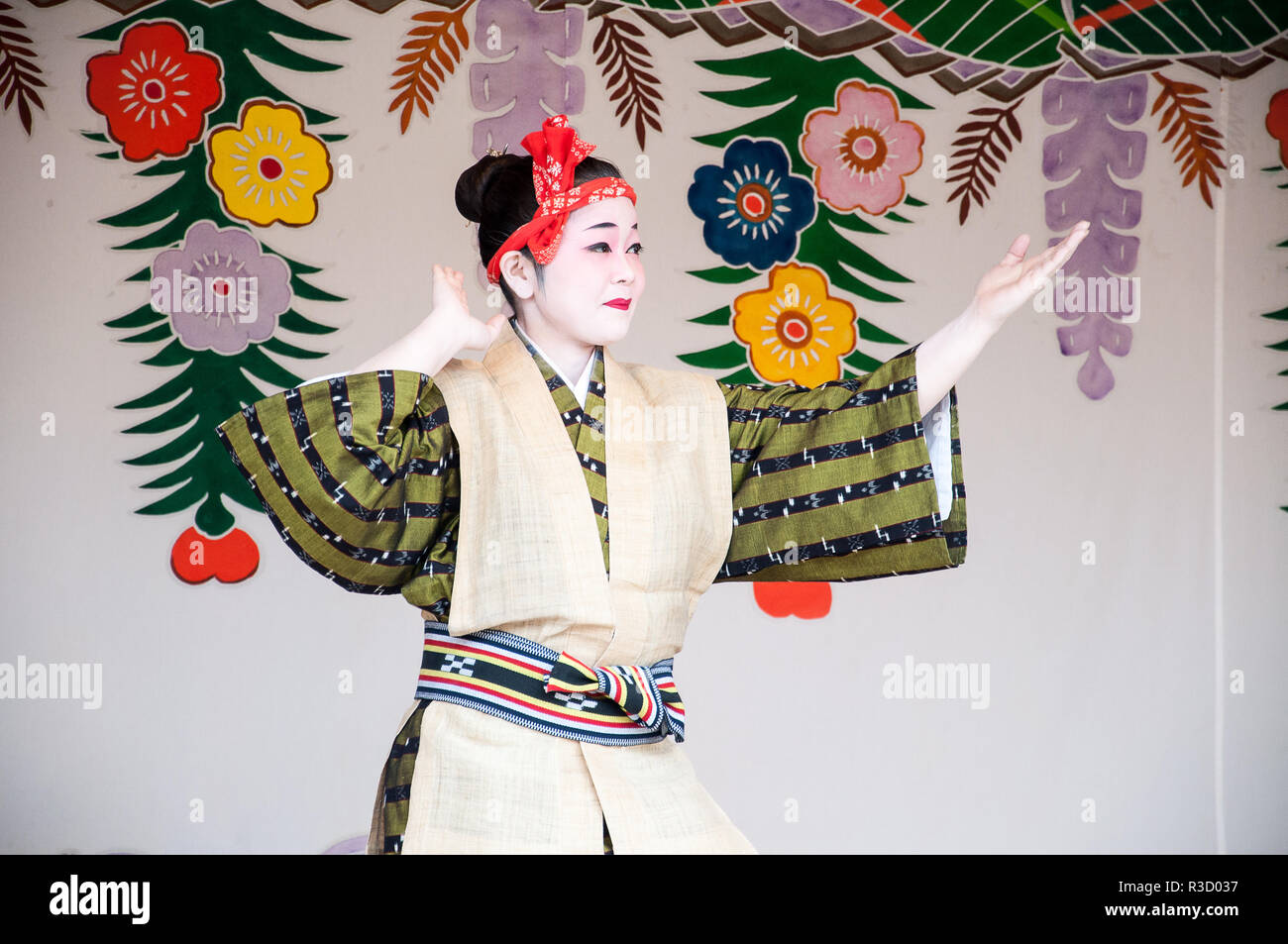 Okinawa, Japan - March 10, 2013 : Unidentified female dancer performing Okinawa traditional dance at Shuri Castle Stock Photo