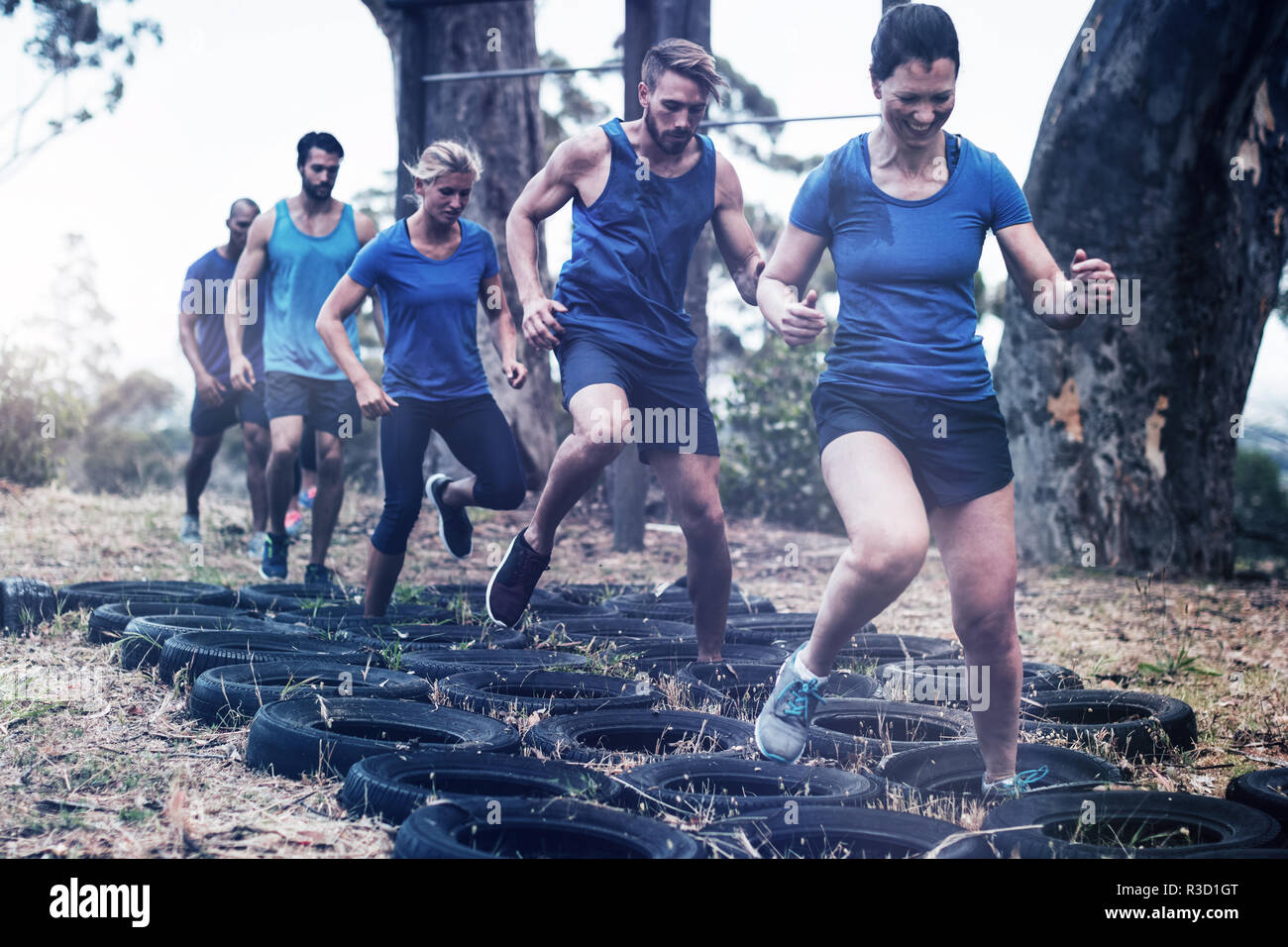 People receiving tire obstacle course training Stock Photo