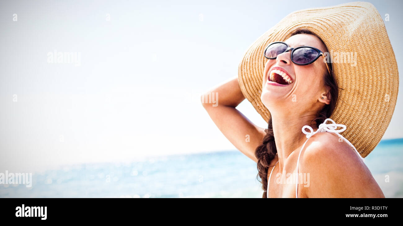 Portrait of smiling woman on the beach Stock Photo - Alamy