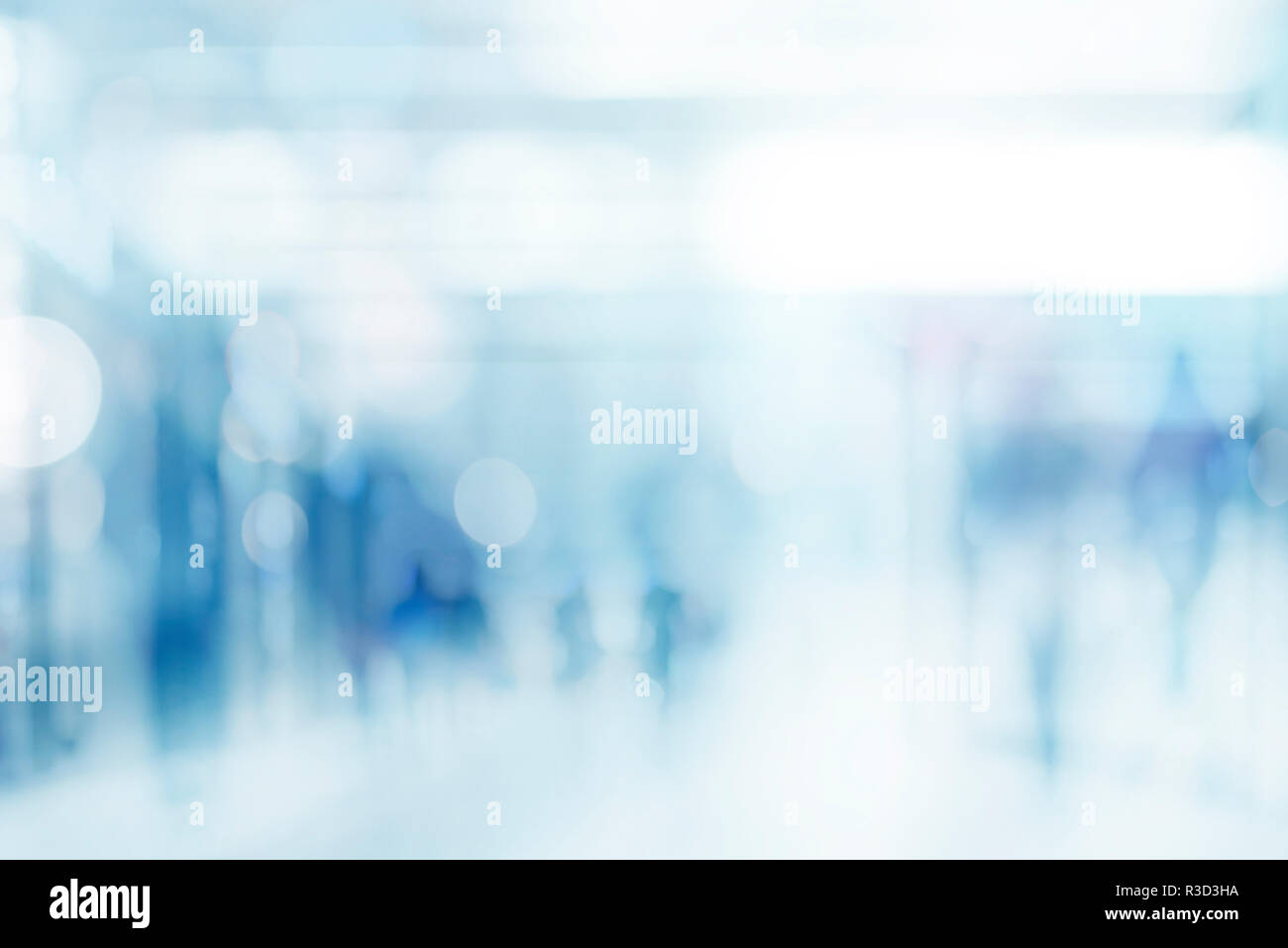 abstract defocused blurred empty space technology background with silhouettes of unrecognizable people Stock Photo