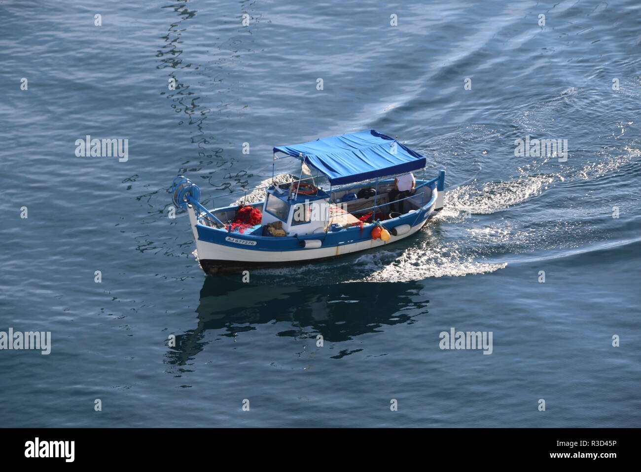 small blue fishing boat Stock Photo - Alamy