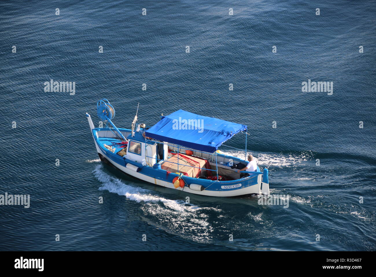 small blue fishing boat Stock Photo - Alamy
