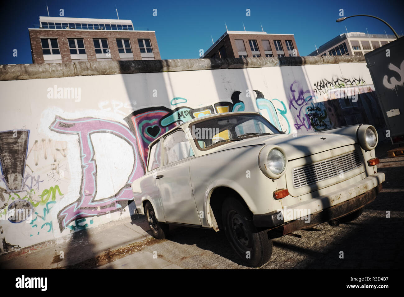 Berlin Germany - Trabant car parked alongside the Berlin Wall at the East Side Gallery - 2018 Stock Photo