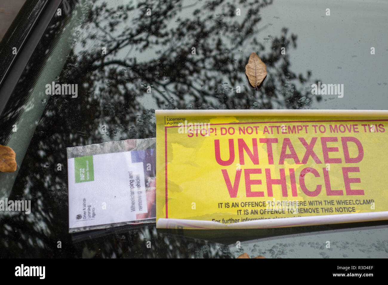 Untaxed Vehicle sticker on a windscreen in LOndon Stock Photo