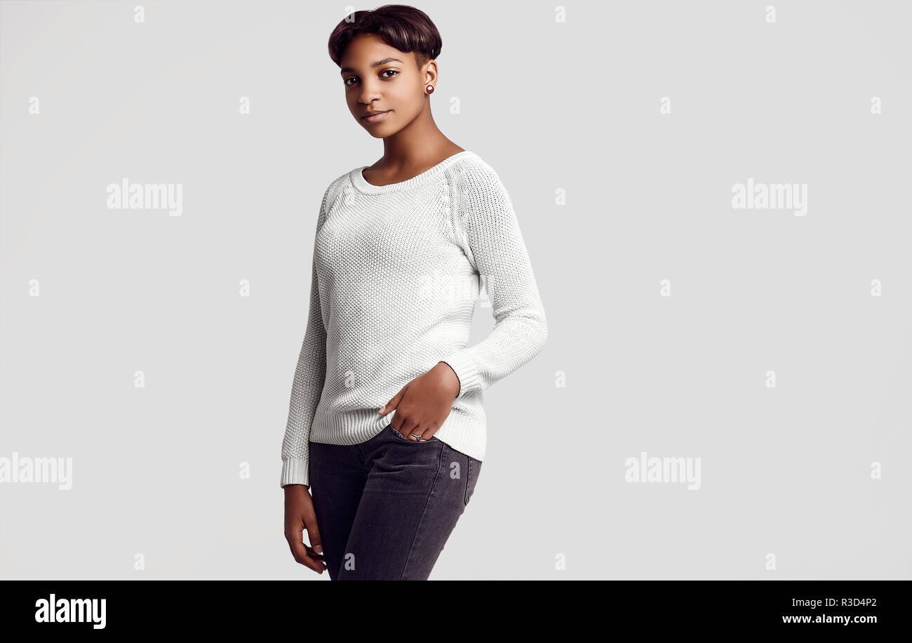 Portrait of young beautiful hipster black girl with short hair smiling