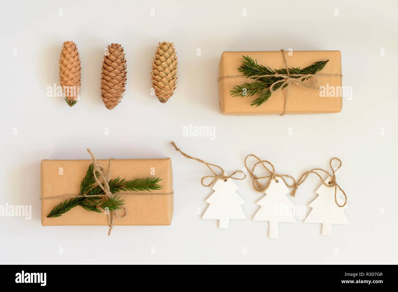 Christmas composition. Gift boxes in craft paper with fir tree branches ...