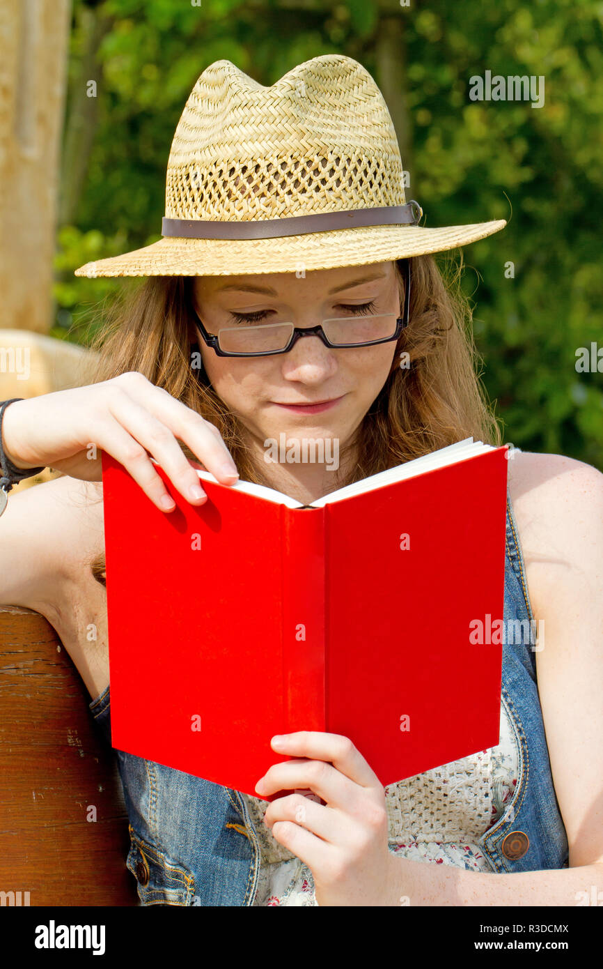 young woman with book Stock Photo