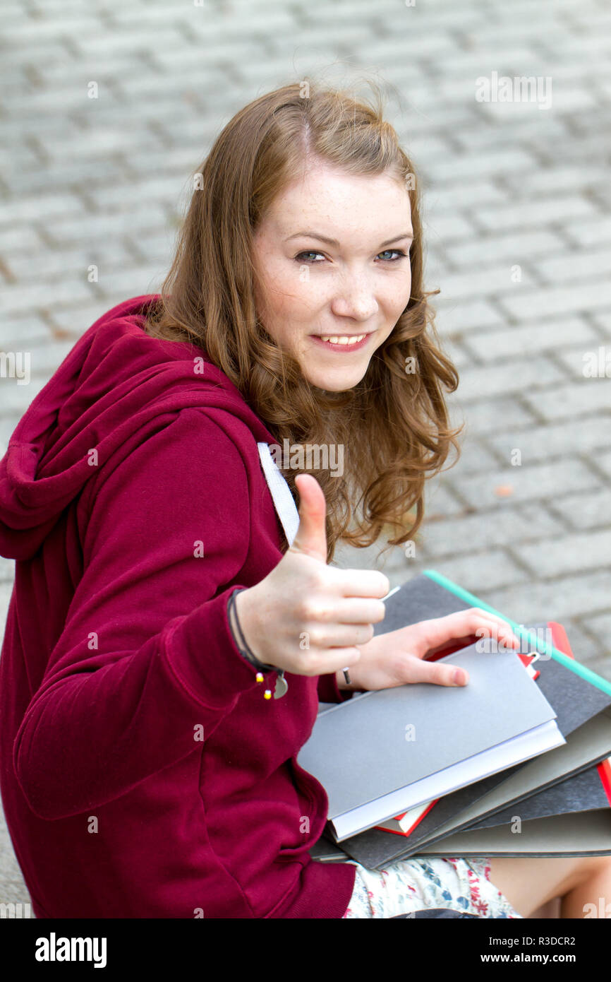 female student with thumbs up Stock Photo - Alamy