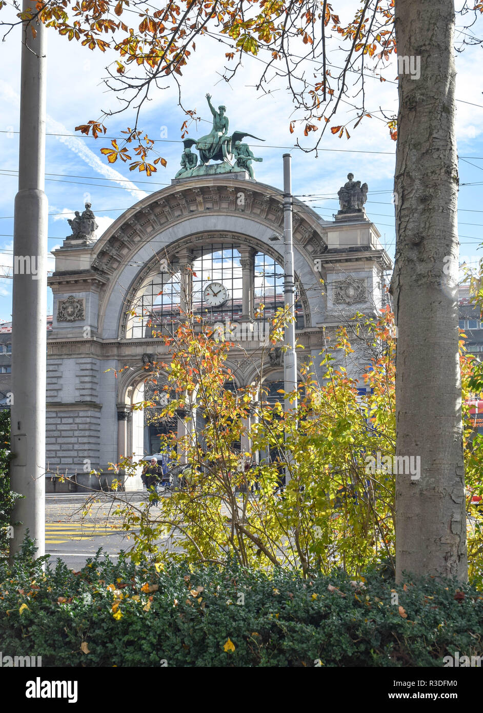 Historic landmark arch topped by Zeitgeist sculpture (the former entry of the old station that was destroyed by fire in the early 1970s)  at the Bahnh Stock Photo