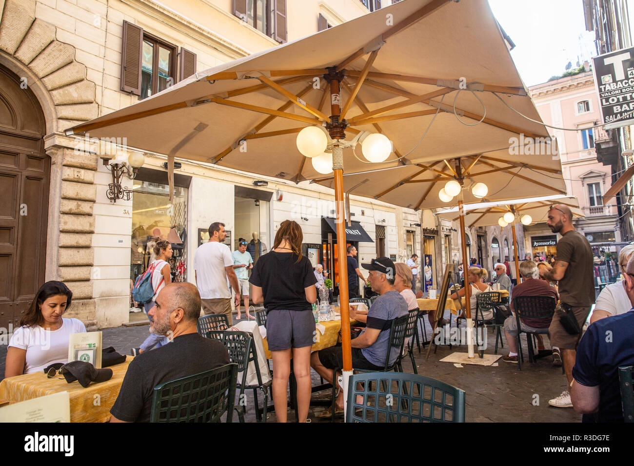 People enjoying alfresco lunch in Rome at a restaurant beside the Pantheon hotel,Rome,Italy Stock Photo