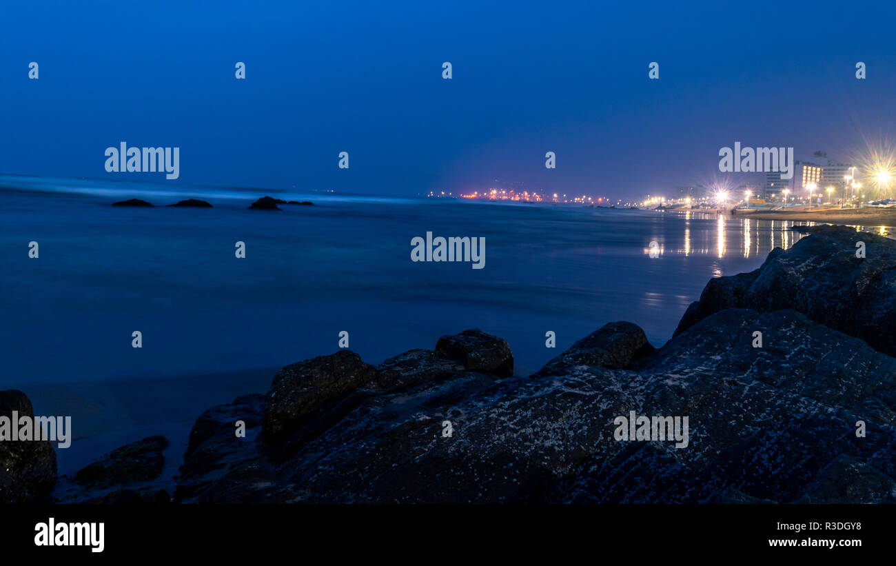 RK Beach or Ramakrishna Beach at the time of blue hour,  is situated on the East coast of Bay of Bengal in Visakhapatnam.  Slow shutter speed is appli Stock Photo