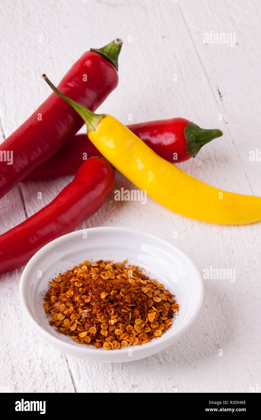 fresh pepperoni and chilli with chili powder as closeup Stock Photo
