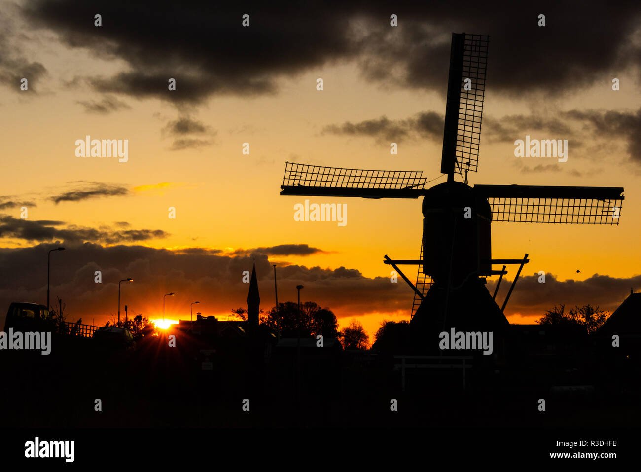 Dutch windmill during sunrise in the Netherlands Stock Photo - Alamy