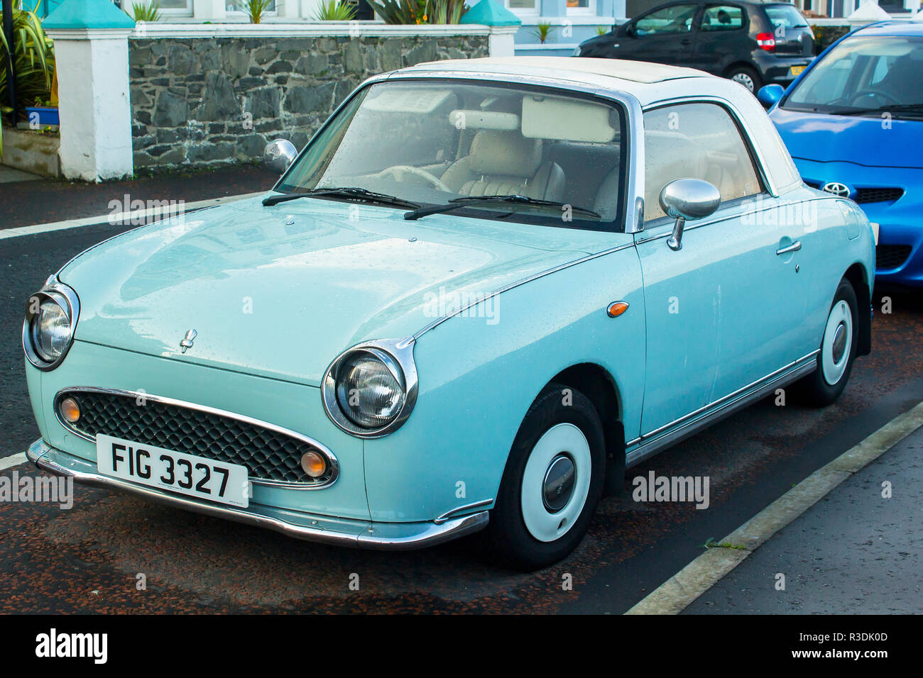11 October 2018 A Classis Nissan Figaro automatic convertible car with mint chrome trim parked on the Seacliff Road in Bangor County Down Northern Ire Stock Photo
