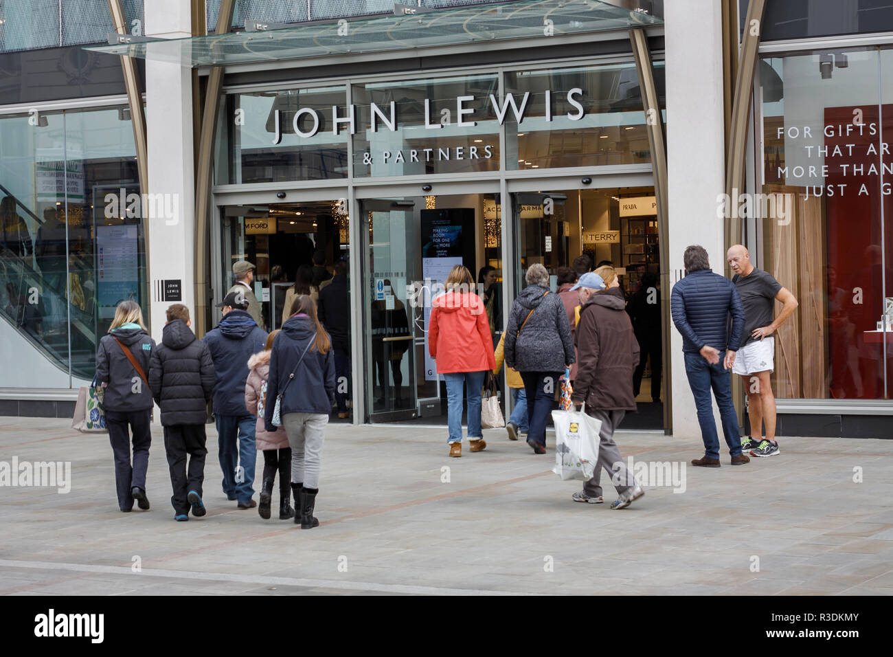 Shoppers at the main entrance of the new John Lewis department store on Cheltenham High Street Stock Photo