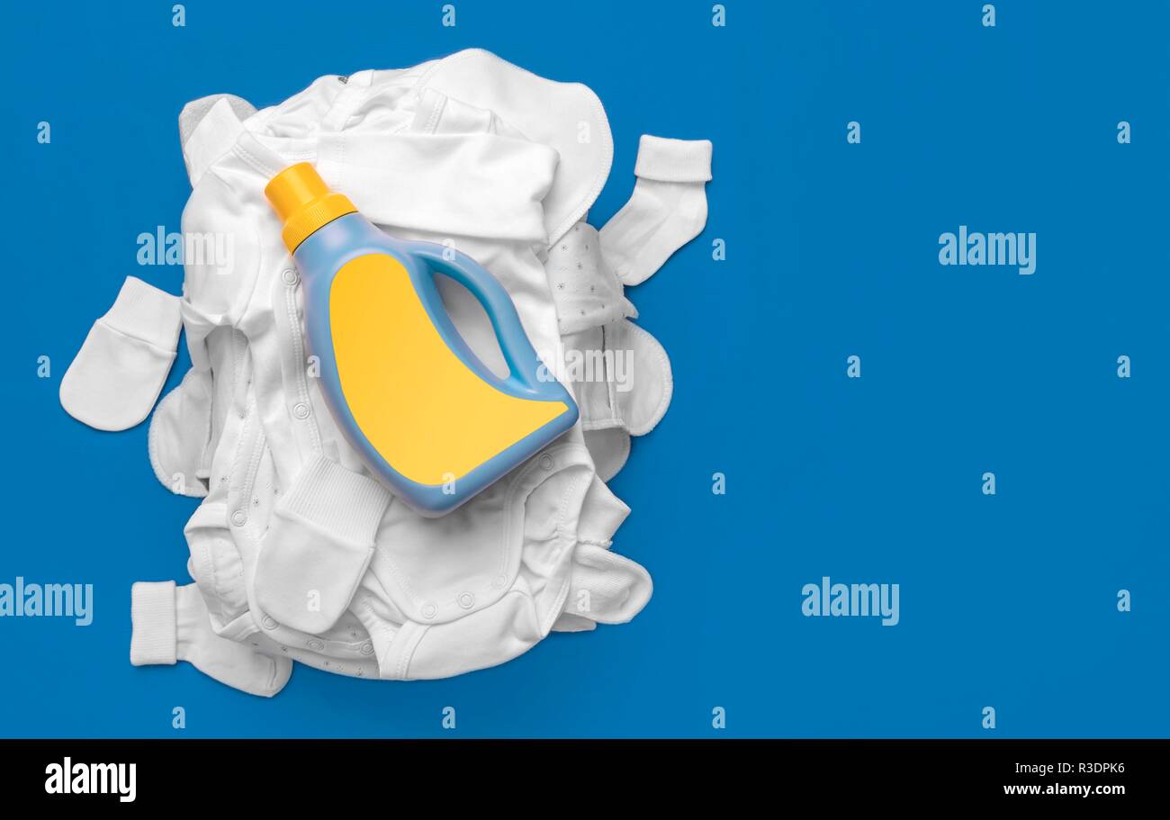 Means for washing on a pile of dirty baby clothes Stock Photo Alamy