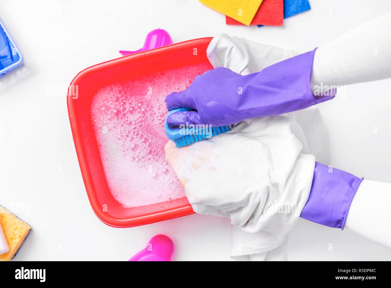 Clean the stain with a brush and detergent. Stock Photo